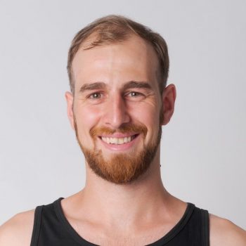 Smiling man with a beard.