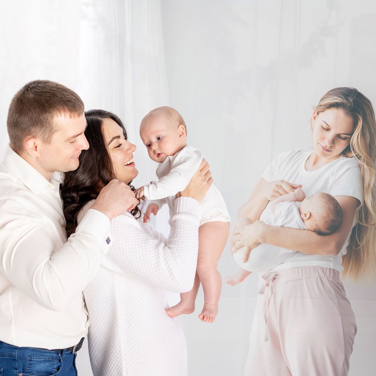 Family posing with two babies.