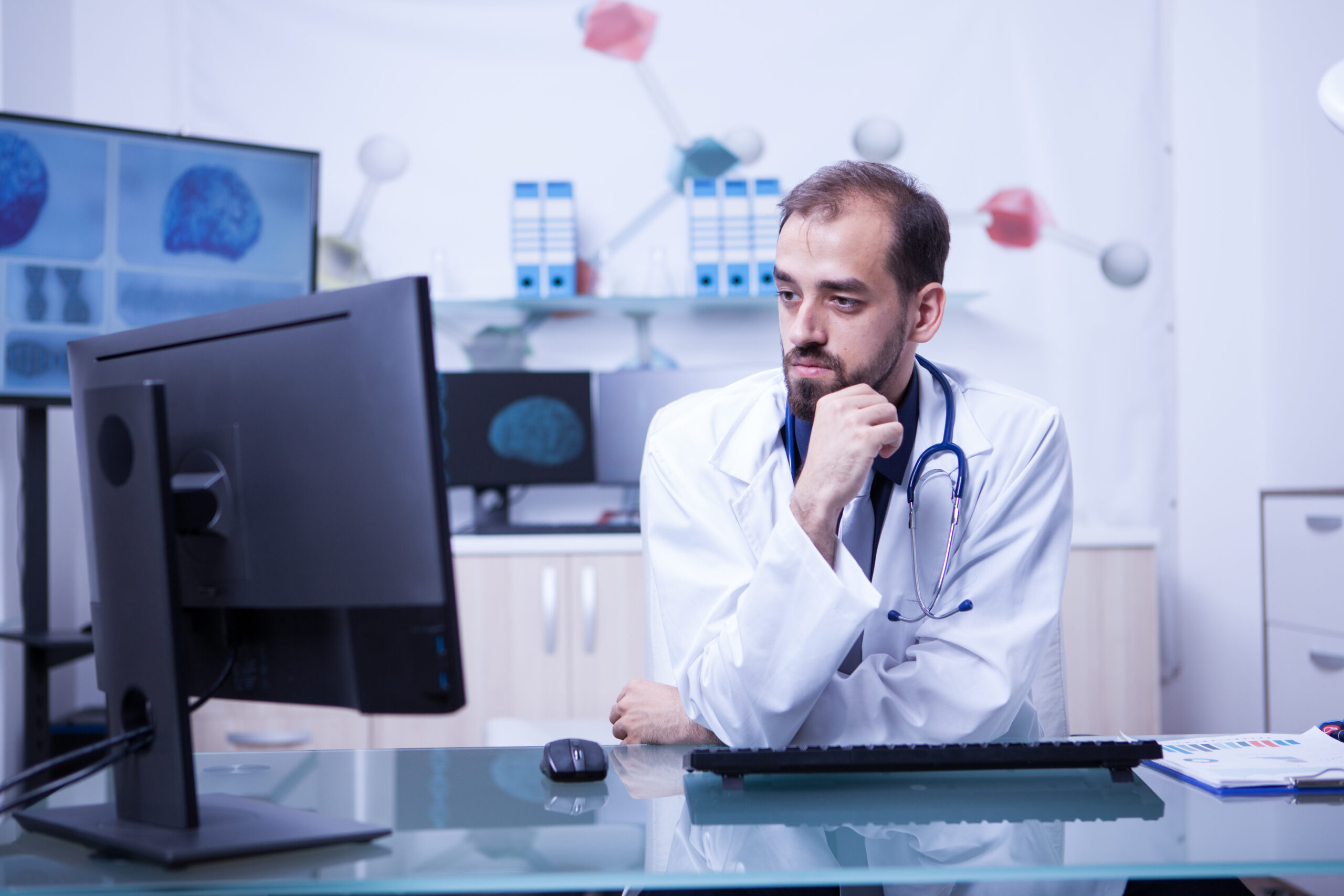 Portrait of a thoughtful young doctor looking