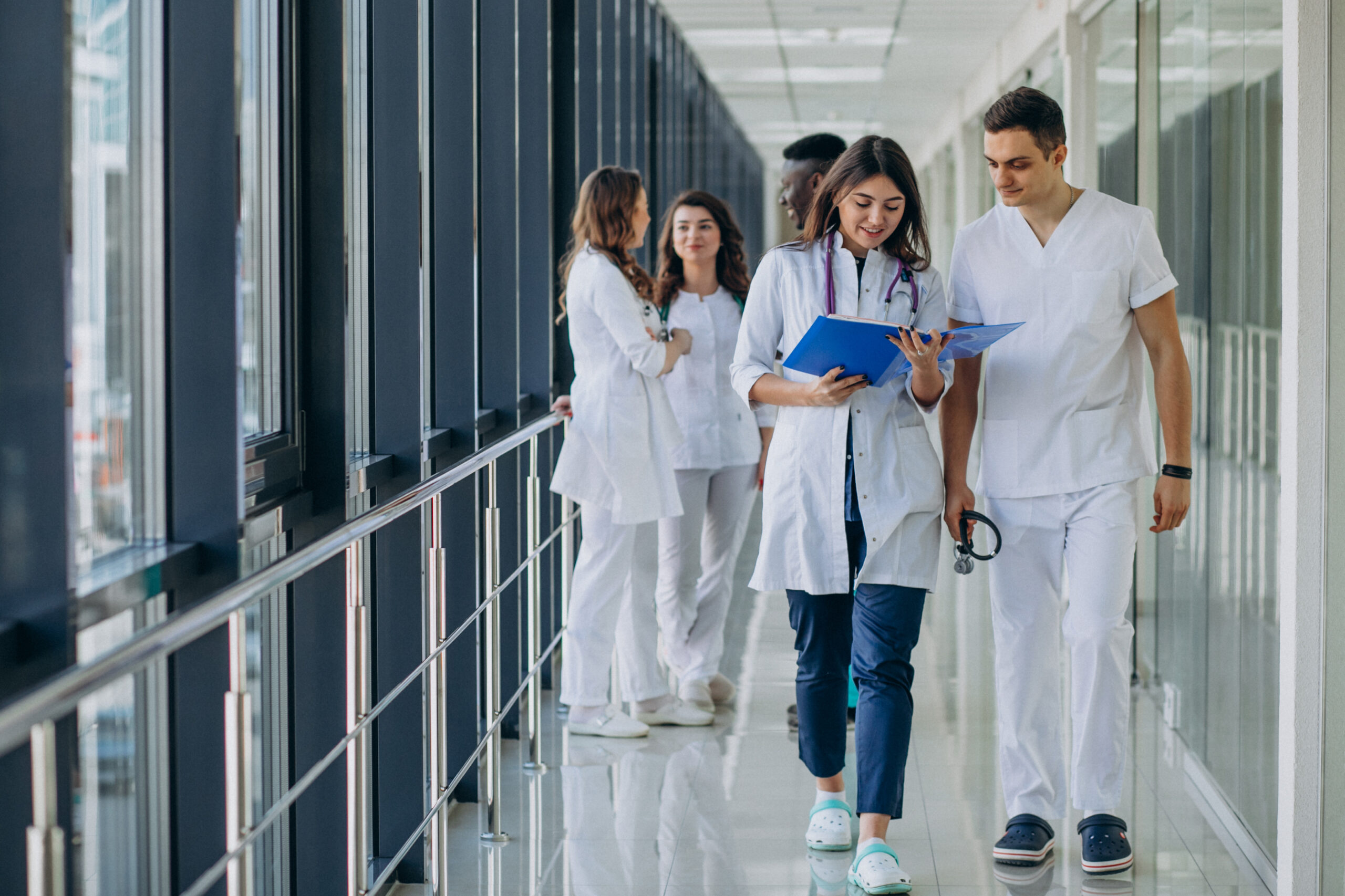 Medical students walking in hallway.