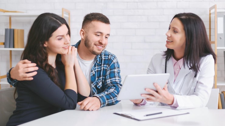 Doctor showing couple tablet results.